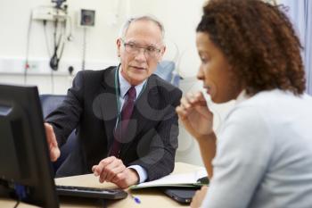 Consultant Meeting With Patient In Office