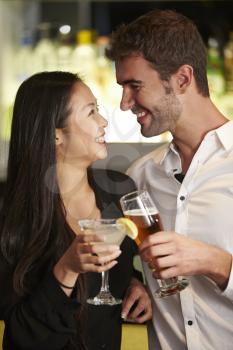 Couple Enjoying Drink In Bar