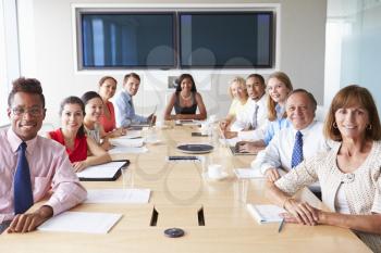 Point Of View Shot Of Businesspeople Around Boardroom Table