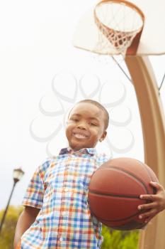 Portrait Of Boy On Basketball Court