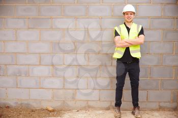 Portrait Of Male Construction Worker On Building Site