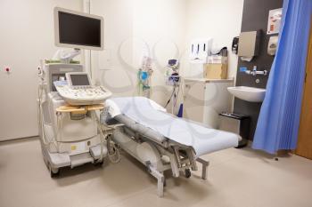 Treatment Area In Modern Hospital With Ultrasound Equipment