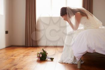 Bride In Bedroom Having Second Thoughts Before Wedding