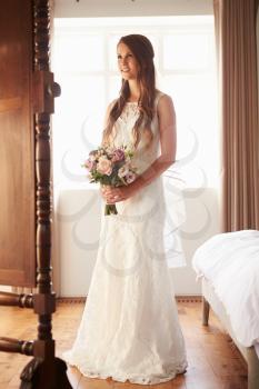 Beautiful Bride In Bedroom Looking at Mirror
