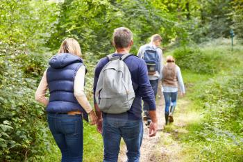 Family On Walk Through Beautiful Countryside