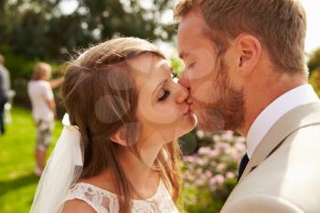 Romantic Young Couple Kissing On Wedding Day
