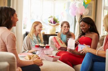 Group Of Female Friends Meeting For Baby Shower At Home
