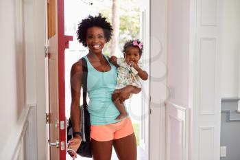 Young black woman and child arrive home after exercising
