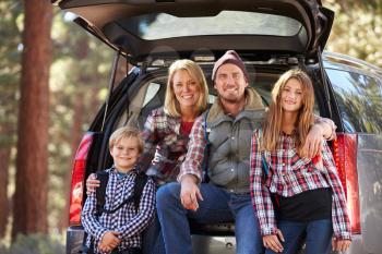 Portrait of family by their car before hiking, California