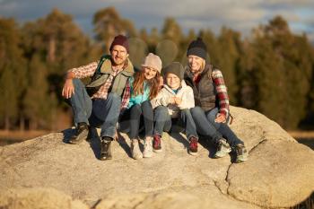Portrait of Family sitting on rocky outcrop, California, USA