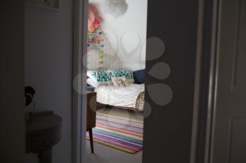 Child's Bedroom In Contemporary Family Home Through Door