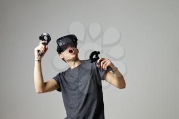 Man In Studio Wearing Virtual Reality Headset Playing Game
