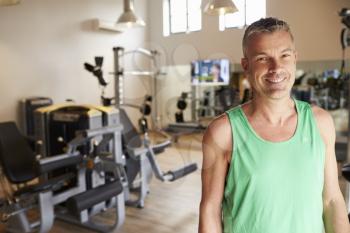 Portrait Of Mature Man Standing In Gym