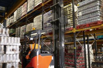 Moving stock in distribution warehouse with an aisle truck