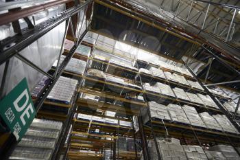 Low angle view of tall shelving racks at a warehouse