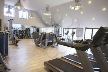 Empty gym with modern fitness equipment