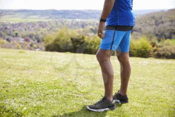 Close Up Of Mature Man Jogging In Countryside