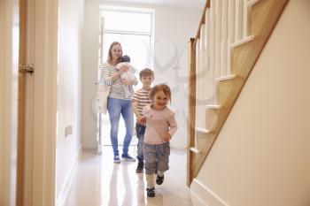 Young Family Looking Around Property For Sale