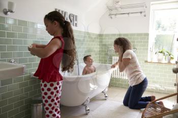 Children Having Bath And Brushing Teeth In Bathroom