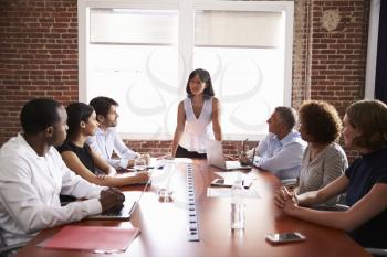 Businesswoman Addressing Boardroom Meeting