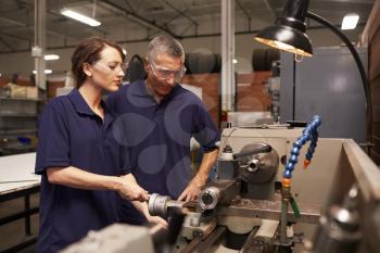 Engineer Training Female Apprentice On Milling Machine