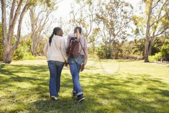 Mature Couple Going On Picnic In Park Together