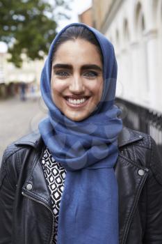 Portrait Of British Muslim Woman In Urban Environment