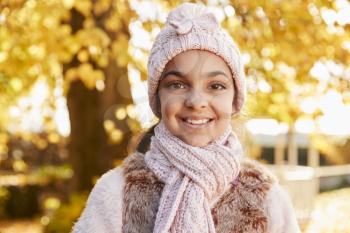 Outdoor Portrait Of Girl Wearing Hat And Scarf In Autumn