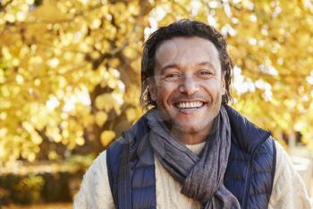 Outdoor Portrait Of Mature Man Wearing Scarf In Autumn