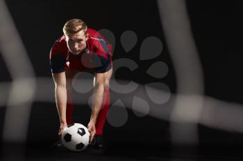 Professional Soccer Player Placing Ball For Penalty Kick