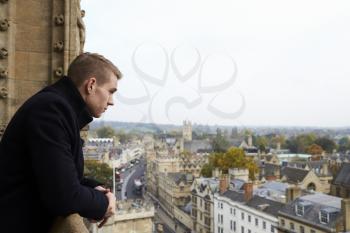 Tourist Looking Out Over View Of Oxford Skyline
