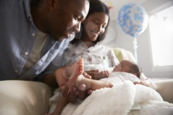 Parents Home From Hospital With Newborn Baby