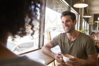 Couple Meeting For Date In Coffee Shop