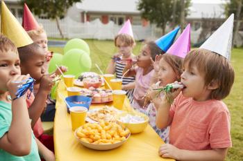 Children Enjoying Outdoor Birthday Party Together
