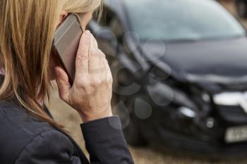 Woman Calling To Report Car Accident On Country Road