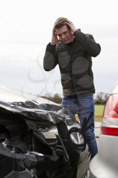 Frustrated Man With Damaged Car After Accident