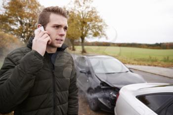 Man Calling To Report Car Accident On Country Road