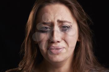 Studio Shot Of Crying Young Woman With Smudged Eye Make Up