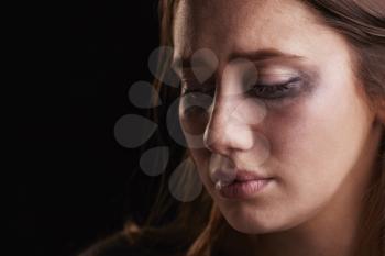 Studio Shot Of Crying Young Woman With Smudged Eye Make Up