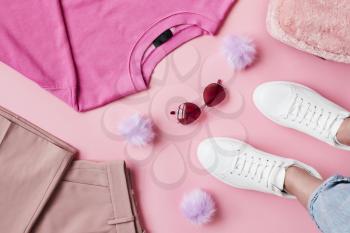 Flat Lay Shot Of Female Pastel Pink Clothing With Feet