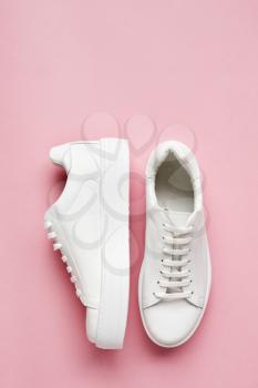 Overhead Shot Of White Sneakers On Pink Background