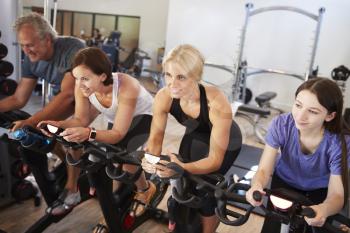 Group Taking Spin Class In Gym