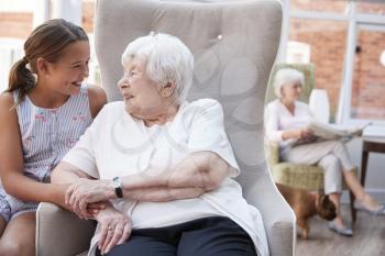 Granddaughter Visiting Grandmother In Retirement Home