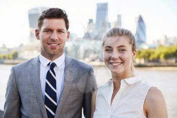 Portrait Of Businesspeople Standing By River Thames In London