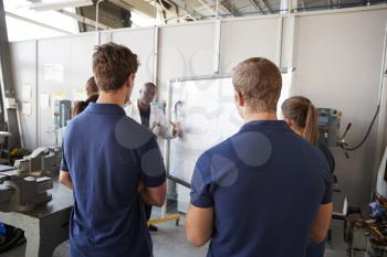 Engineering apprentices at a training presentation, back view