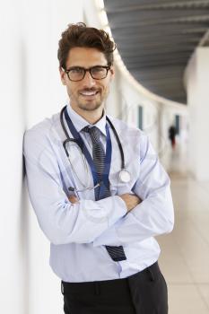 Portrait of young male doctor with stethoscope, smiling