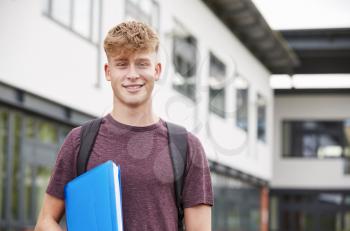 Portrait Of Male Student Standing Outside College Building