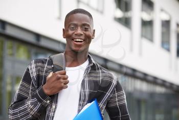 Portrait Of Male Student Standing Outside College Building