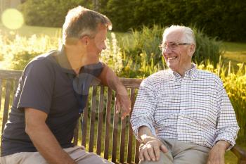 Man Visiting Senior Male Relative In Assisted Living Facility