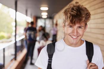 Portrait Of Male Teenage Student On College With Friends